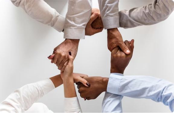 hands interlocked to show unity